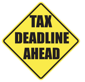 Tax Deadline Ahead warning sign with black letters over a yellow background